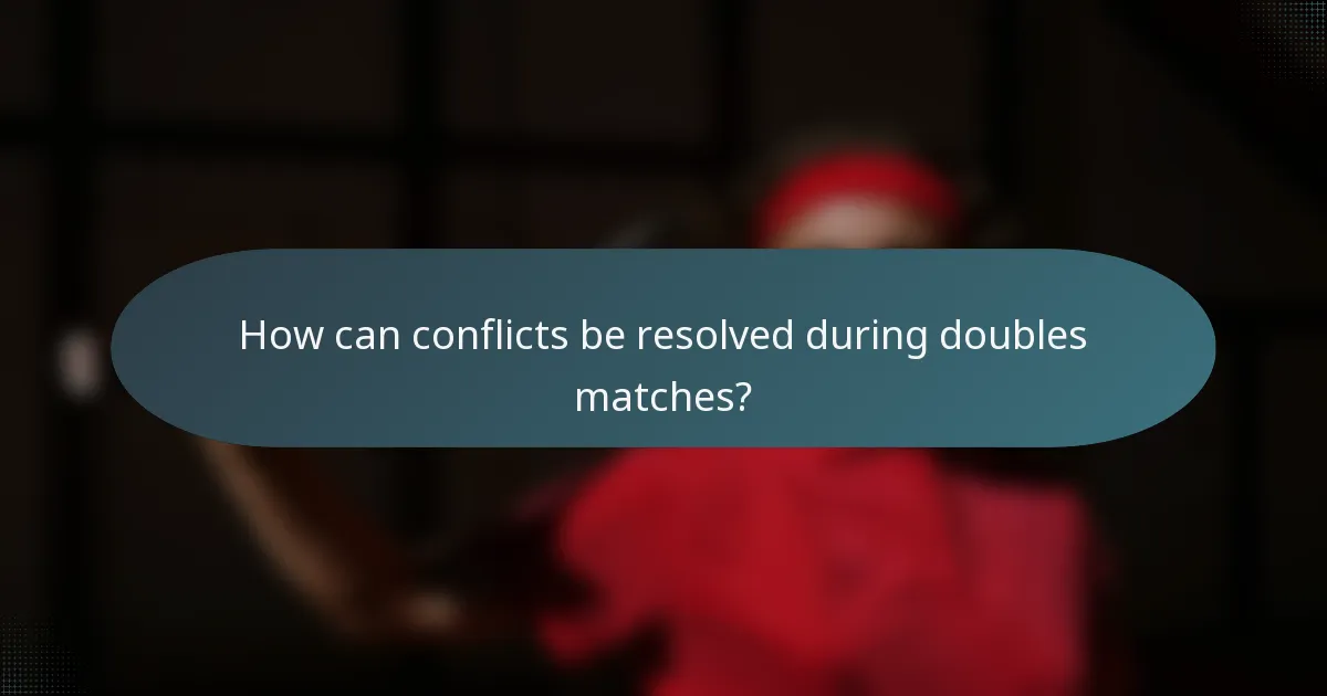 How can conflicts be resolved during doubles matches?