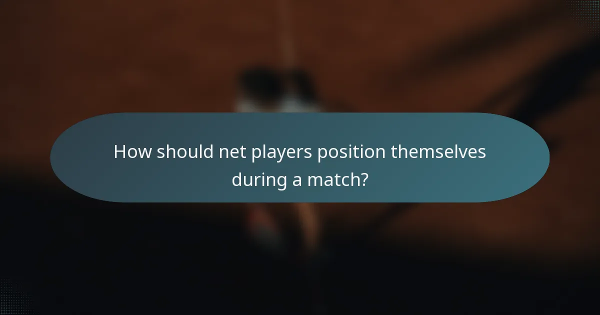 How should net players position themselves during a match?