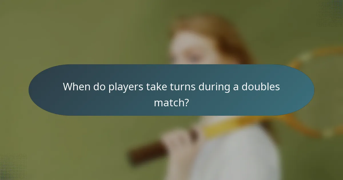 When do players take turns during a doubles match?